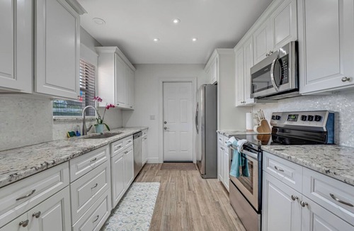 Parrot Cove House | Charming Lake Worth Beach Pool Home –Heated Pool, Walk to DT, 1 M to Beach!