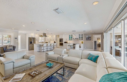 Causeway Isles House | Chic waterfront retreat with private pool and outdoor kitchen near the beach