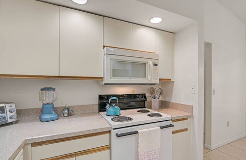 Trailer Estates Condo | Close to Beaches, Shopping, Near IMG and Dining- Community Pool and Hot Tub