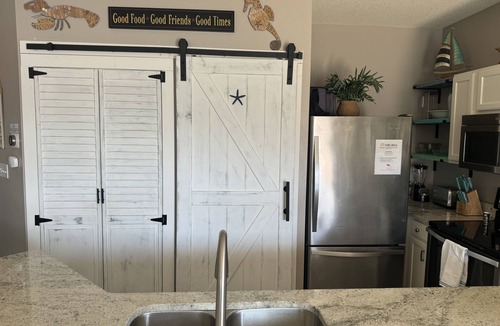Holiday Isle Condo | Coastal Charm, pet friendly, private beach, free beach chairs service.