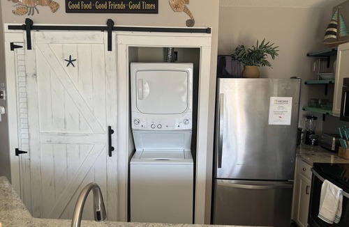 Holiday Isle Condo | Coastal Charm, pet friendly, private beach, free beach chairs service.