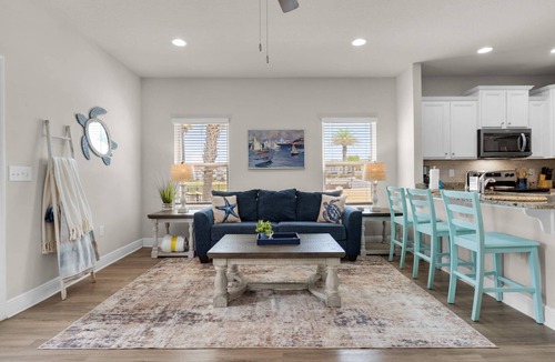 Thomas Drive House | Coastal Panama City Beach Retreat | Pet-Friendly, Private Deck, Pool, Garage, & $300 Fee Fun!