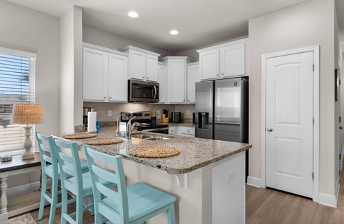 Thomas Drive House | Coastal Panama City Beach Retreat | Pet-Friendly, Private Deck, Pool, Garage, & $300 Fee Fun!