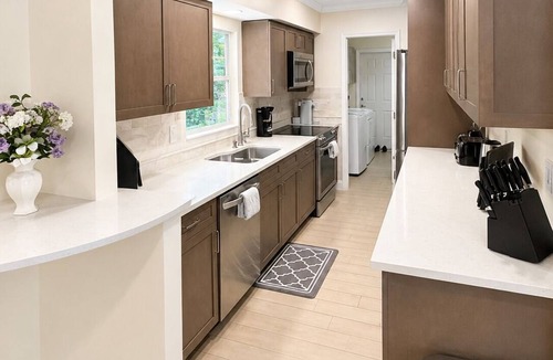 Tropic Palms House | Coastal retreat with heated saltwater pool & spa in prime Delray Beach.