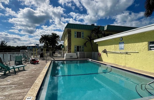 Marathon Condo | Coco Plum Beach Paradise: Water Views, Heated Pool, and Boat Slip.