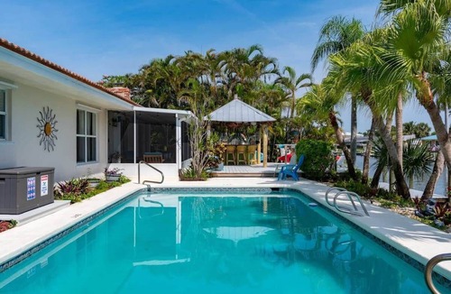 Cocoa Isles House | Cocoa Beach Waterfront Home with Tiki Bar and Pool
