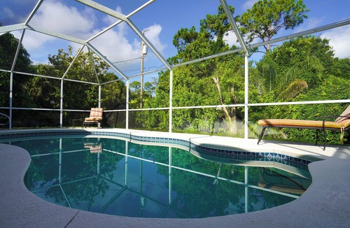 Sebastian Highlands House | Come Home to Paradise…. Screened in pool with covered lanai and hot tub