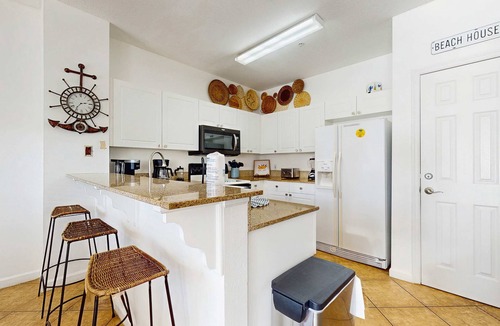 Frangista Beach Condo | Comfortable ground floor condo with pool & hot tub access, W&D, WiFi, and AC