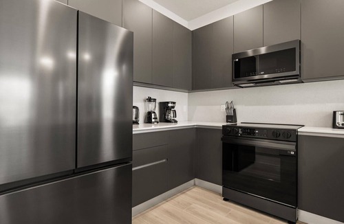 Four Corners Villa | Contemporary 4BR Townhome With Pool & Themed Rooms