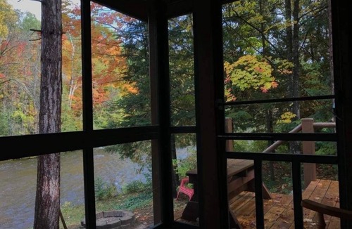Ellis Township Cabin | Cozy river cabin, steps away from blue ribbon fishing hiking trails.