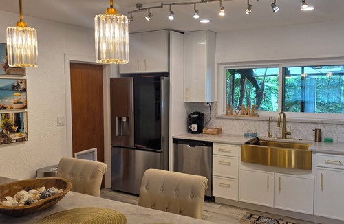 Lake Magdalene House | Cozy tropical home with lush palms, warm lights & relaxing vibe.