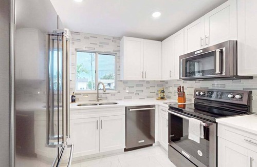 Isles of Capri Condo | Dog-friendly duplex with a patio, deck, washers, dryers, & central AC