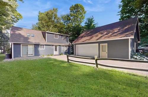 Suttons Bay House | Dog-friendly secluded home near Suttons Bay with water views, firepit, fireplace