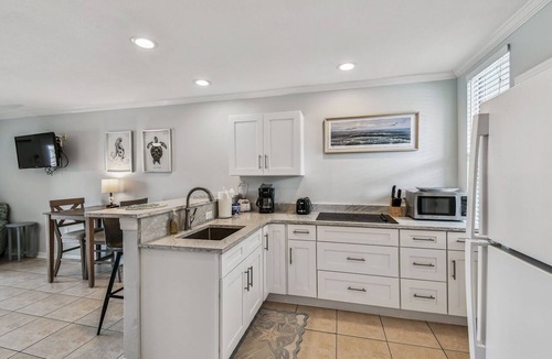 Bay Esplanade Apartment | Enchanted Inn Suite #4: Waterfront, Pool, Fishing Dock, Boat Docks & Tiki Bar!