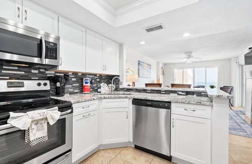 Daytona Beach Shores Condo | Enjoy stunning ocean views from the balcony, living room, dining area, and kitchen. This 2BR condo features a heated beachfront pool, fitness room, king beds in both bedrooms, and comfortably sleeps 4 in beautiful Daytona Shores.