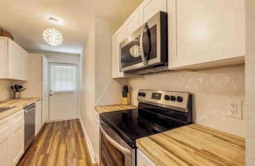 Bayou Oaks House | Exquisite bungalow with shared pool, washer & dryer, and WIFI