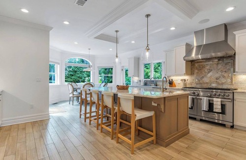 Tuckahoe House | Exquisite Southampton estate with a private heated pool and expansive.
