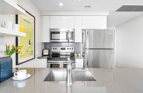 Coconut Grove Apartment | Major international sporting event Prep: Grove Luxe Balcony & Bay View