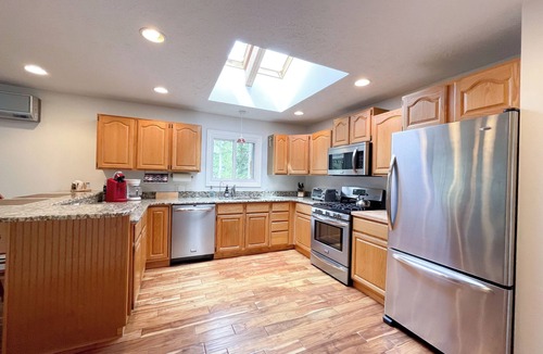 Traverse City House | Forest Edge Burrow - Wooded Yard, Hot Tub, with Long Lake Access