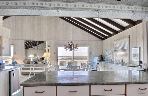 Stone Harbor House | FRIDAY TO FRIDAY RENTAL. Enjoy the beautiful sunsets - Large 2nd floor deck with pretty water views and great awnings to block the warm afternoon sun.