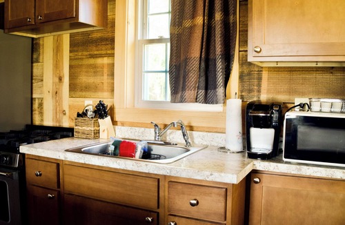 Ashburn Cabin | Georgia Golf Cottage with 9-hole course, pool, tennis court, clubhouse and more!