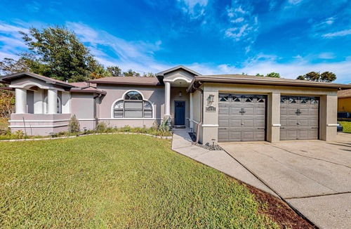 Spring Hill House | Gorgeous oasis with pool patio central AC WD and close to the beach