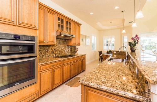 Naples Heritage Villa | Grand 4/3 pool home with beautiful lake sunset views minutes from the beach!