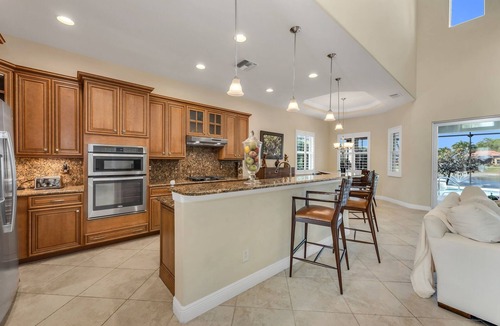 Naples Heritage Villa | Grand 4/3 pool home with beautiful lake sunset views minutes from the beach!