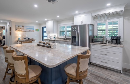 Mid Island House | 🌴 Gus’s Getaway: Heated Pool, 4 Min Walk to Beach, Pet Friendly!