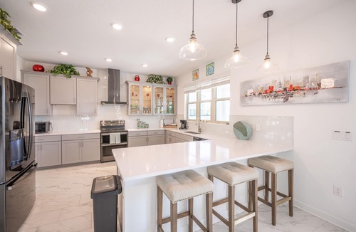 Melbourne Beach House | Harbor Island beach house with private and public pools.