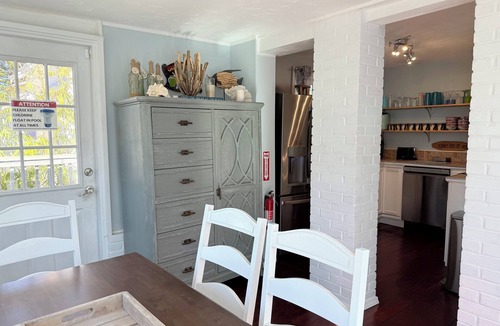 New Smyrna Beach House | Historic Courtyard Cottage with Pool, 1 block to Flagler Ave! Sleeps up to 10