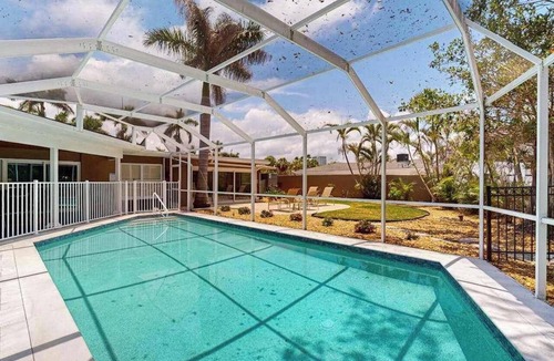 Ringling Estates House | Huge Home with Pool, Home Office, & Sunroom Walk to Lido Beach