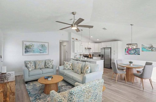 Estero Bay Shores House | Immaculate bay front home w/in ground pool, spa, paver patio & porch