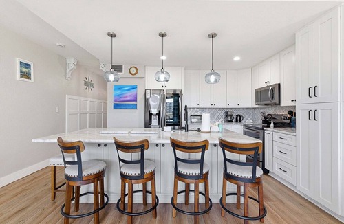 New Smyrna Beach Condo | Intracoastal Waterfront Escape w/Dock, Hot Tub & Walk to Beach