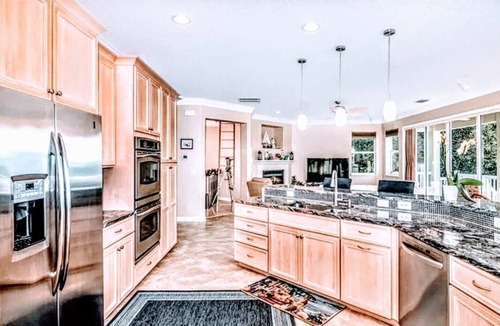 North Beach House | Island Oasis Walk to Beach Heated Pool + Hot Tub Private Putting Green