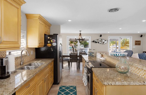 Twin Lakes House | Key Largo Waterfront home with 40’ dock and boat lift. Walk to Pennekamp