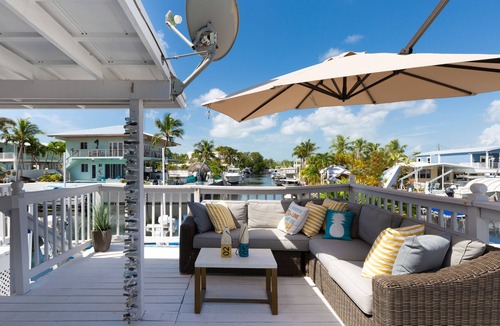 Twin Lakes House | Key Largo Waterfront home with 40’ dock and boat lift. Walk to Pennekamp