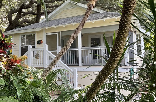 New Smyrna Beach Cottage | Kingfisher Cottage on Canal and two blocks to Ocean, amidst a tropical landscape