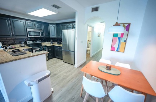 Florida Central Atlantic Coast Apartment | Lakefront resort condo w/balcony, pool, jacuzzi & arcade fun!