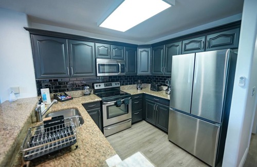 Florida Central Atlantic Coast Apartment | Lakefront resort condo w/balcony, pool, jacuzzi & arcade fun!