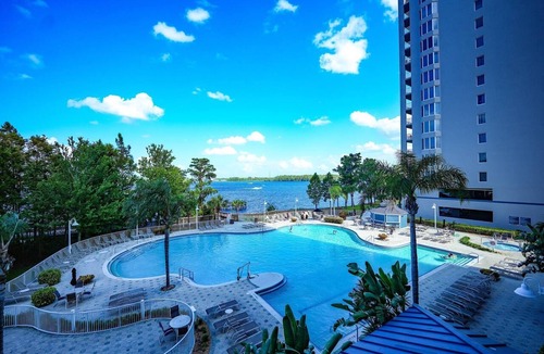 Florida Central Atlantic Coast Apartment | Lakefront resort condo w/balcony, pool, jacuzzi & arcade fun!