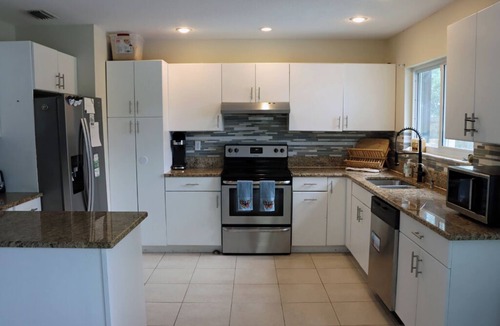 Interchange Square House | Large 4bd 2bth pool home with hot tub, waterfall feature and private back yard!