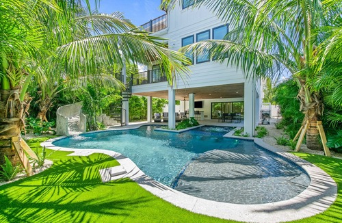 Sarasota House | Lido Key Family Home with Waterslide & Rooftop Views Steps to Beach -Vitamin Sea