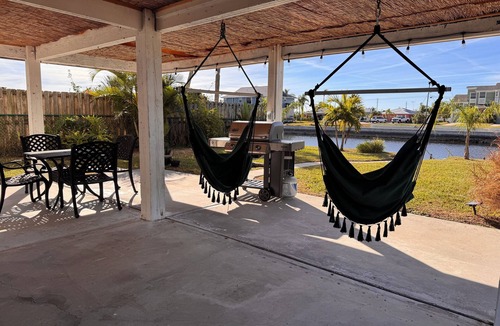 Spring Hill House | Little Stilt House with Boat dock