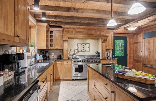 Plainwell Cabin | Log Lodge with Hot Tub, Arcade & Movie Theater