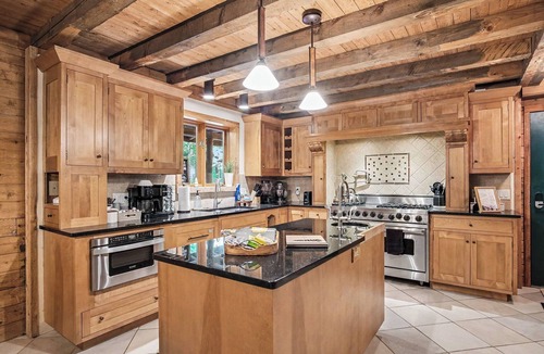 Plainwell Cabin | Log Lodge with Hot Tub, Arcade & Movie Theater