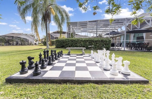 West Kissimmee House | Luxurious 9BR Themed SE Facing Pool Hot Tub Theater Game Room BBQ 2 miles Disney