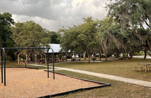 Braden River RV Rental | Luxurious Deluxe Safari Tent with King Bed and Outdoor Fire Pit in Bradenton, Florida