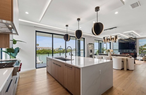 Indian Rocks Beach House | Luxury waterfront home: dock, pool, spa, golf sim