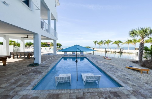Marathon House | Luxury Waterfront Estate—Pool, Spa, Game Lounge, 2 Docks & Ramp Access—Gulfside